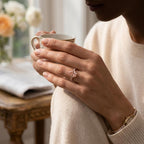 Pear cut pink diamond engagement ring worn on the hand