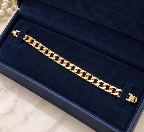 Gold plated Cuban link bracelet in a navy presentation box