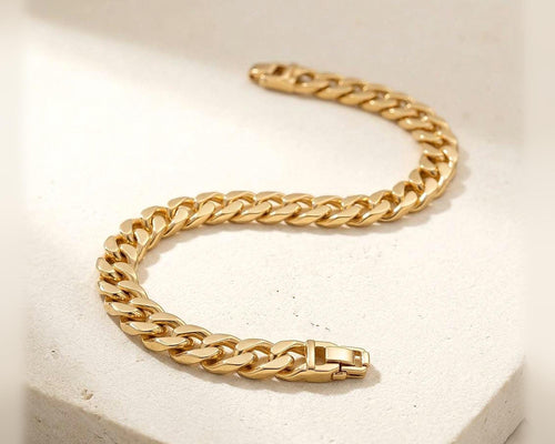Gold plated Cuban link bracelet on ivory fabric