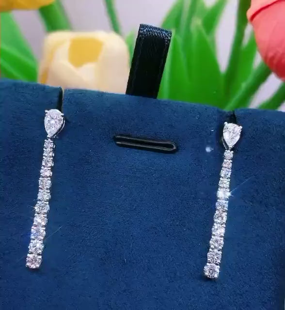 Video of the Pear Cut Diamond Line Drop Earrings